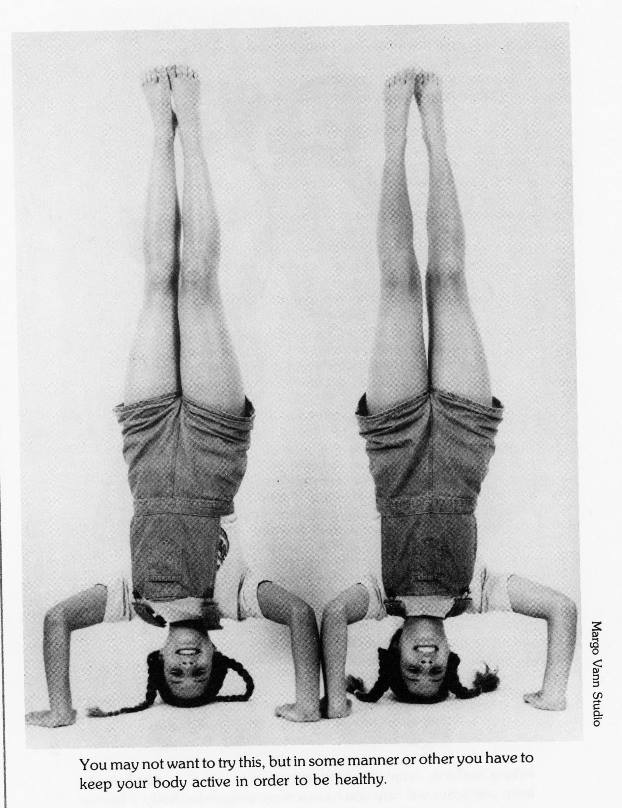 twins doing a headstand