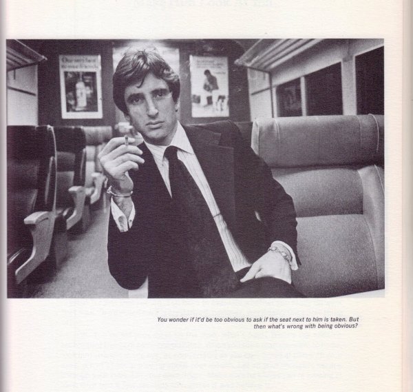 man smoking on a train